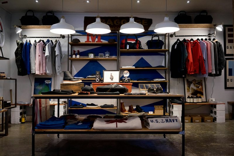 Interior of a retail store with products displayed on lit shelves